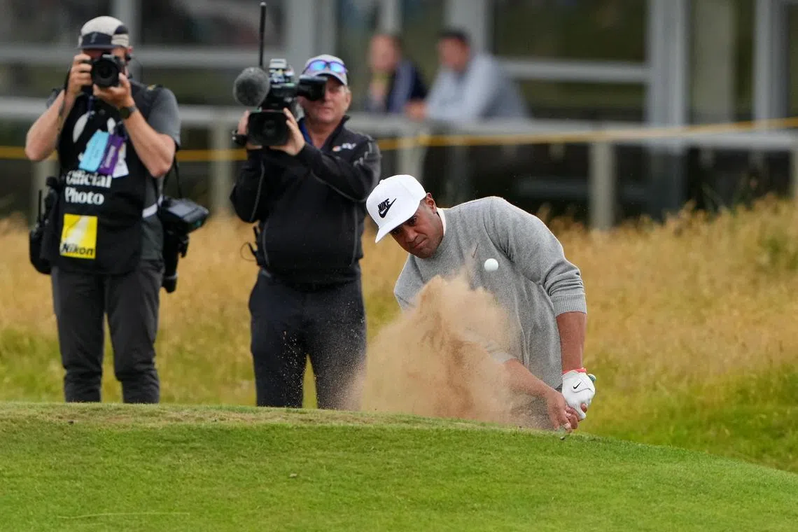 Tony Finau of the United States plays out from a bunker on the 16th hole during the second round of the British Open.