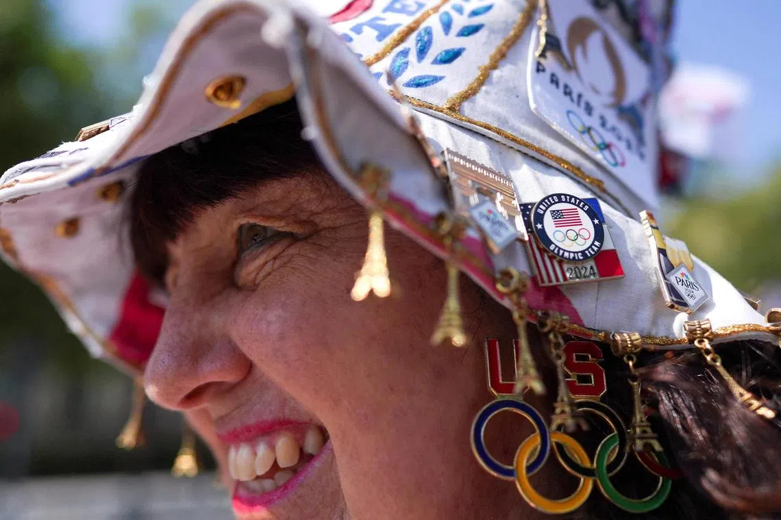 Olympics superfan Vivianne Robinson, who has travelled to her seventh Olympic Games, wears a hat with pins, during the Paris 2024 Olympic Games, in Paris, France July 29, 2024. REUTERS/Leonardo Benassatto