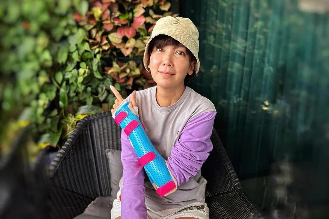 Actress-host Kym Ng broke her wrist while filming, she revealed on Instagram on Wednesday.