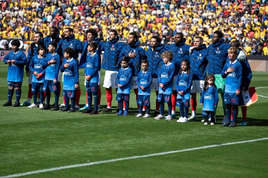 Mar 29, 2026; Landover, Maryland, USA;  France poses starting eleven stands on the field before an international friendly match Colombia at Northwest Stadium. Tommy Gilligan-Imagn Images