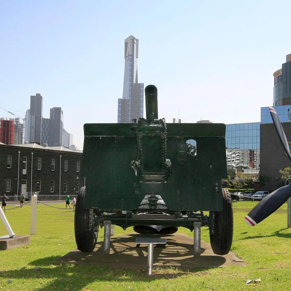 25-Pounder Quick Firing Gun (centre), HMAS Australia's Kedge Anchor (left) and the Douglas C-47 Dakota Propeller (right) on display as a memorial at Victoria Barracks in Melbourne.