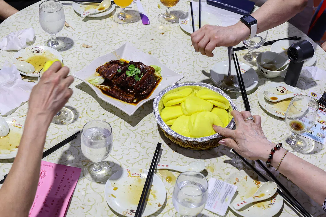 Close-up of braised pork belly served with buns, one of several dishes at a Hungry Ghost Festival dinner auction in Toa Payoh on Aug 23, 2026. ST PHOTO: BRIAN TEO