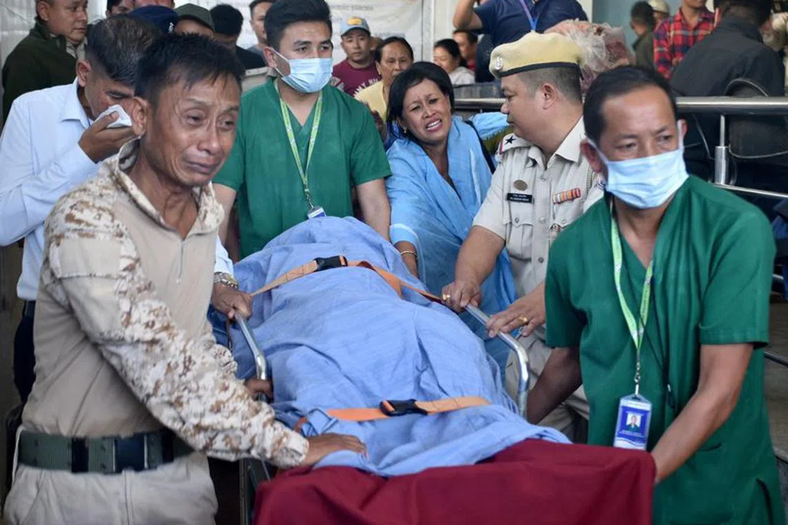 Relatives and police officers mourn as they carry the body of Chingtham Anand, a Sub-Divisional Police Officer (SDPO), after he succumbed to his injuries after he was shot by suspected militants in the border town of Moreh, outside a hospital in Imphal, Manipur, India, October 31, 2023. REUTERS/Stringer