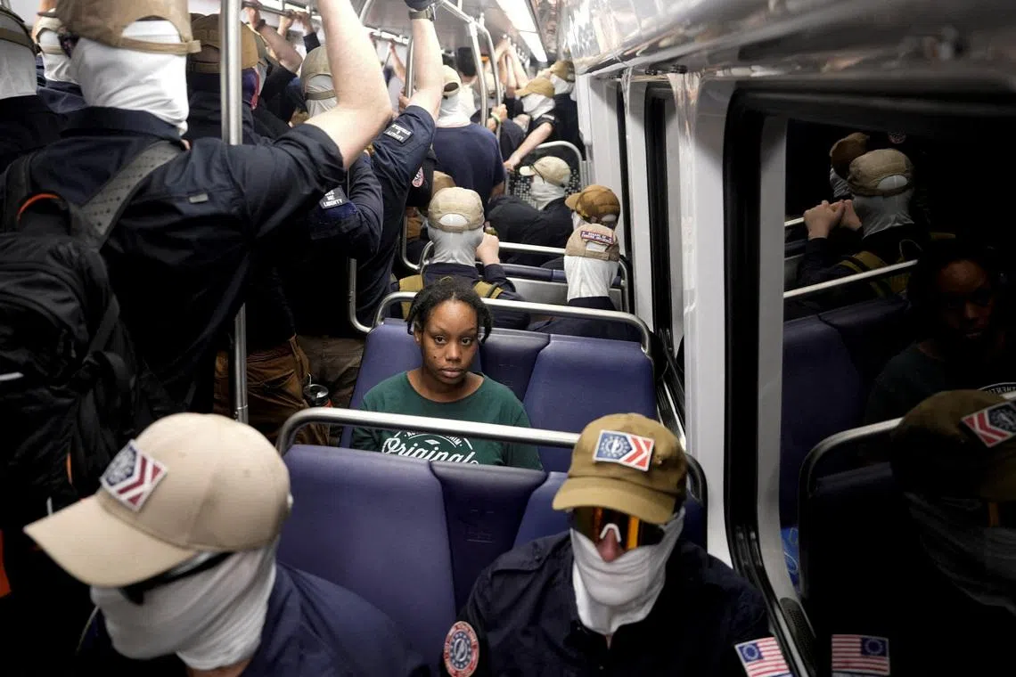 Members of the group Patriot Front ride the metro on the 250th anniversary of U.S. independence in Washington, D.C., U.S., July 4, 2026. REUTERS/Cheney Orr