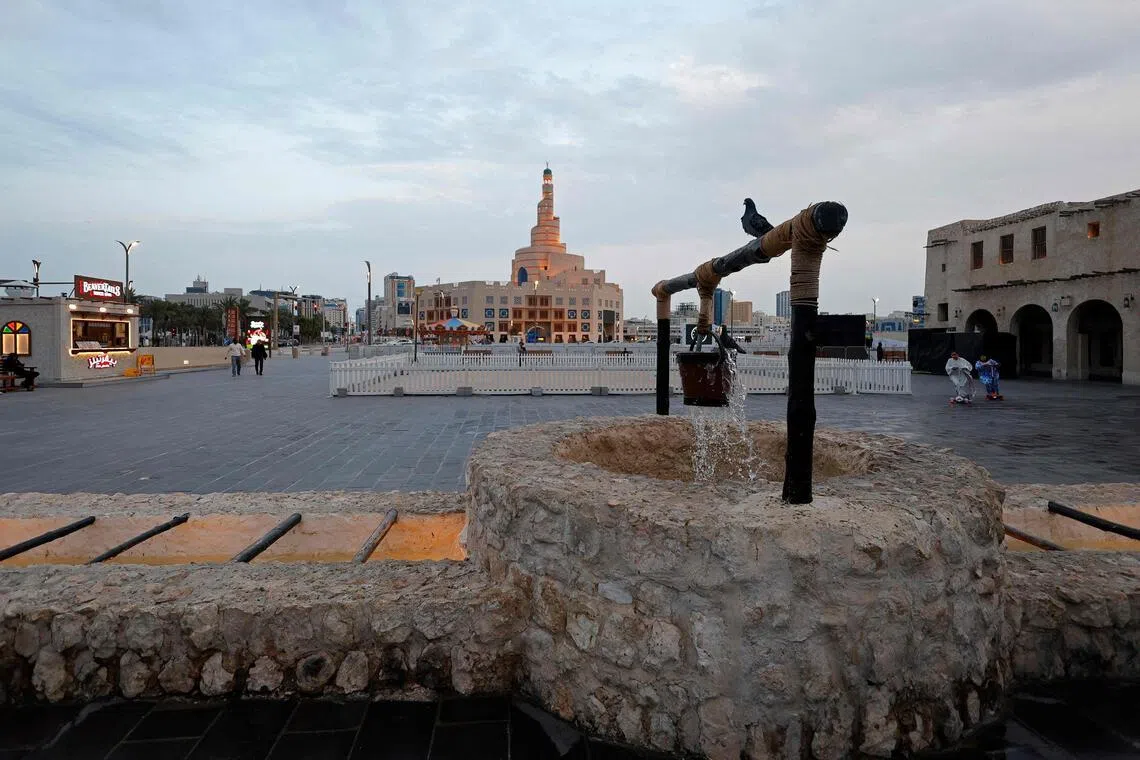 Pigeons sitting on a decorative water fountain in Qatar's capital, Doha, on March 4.