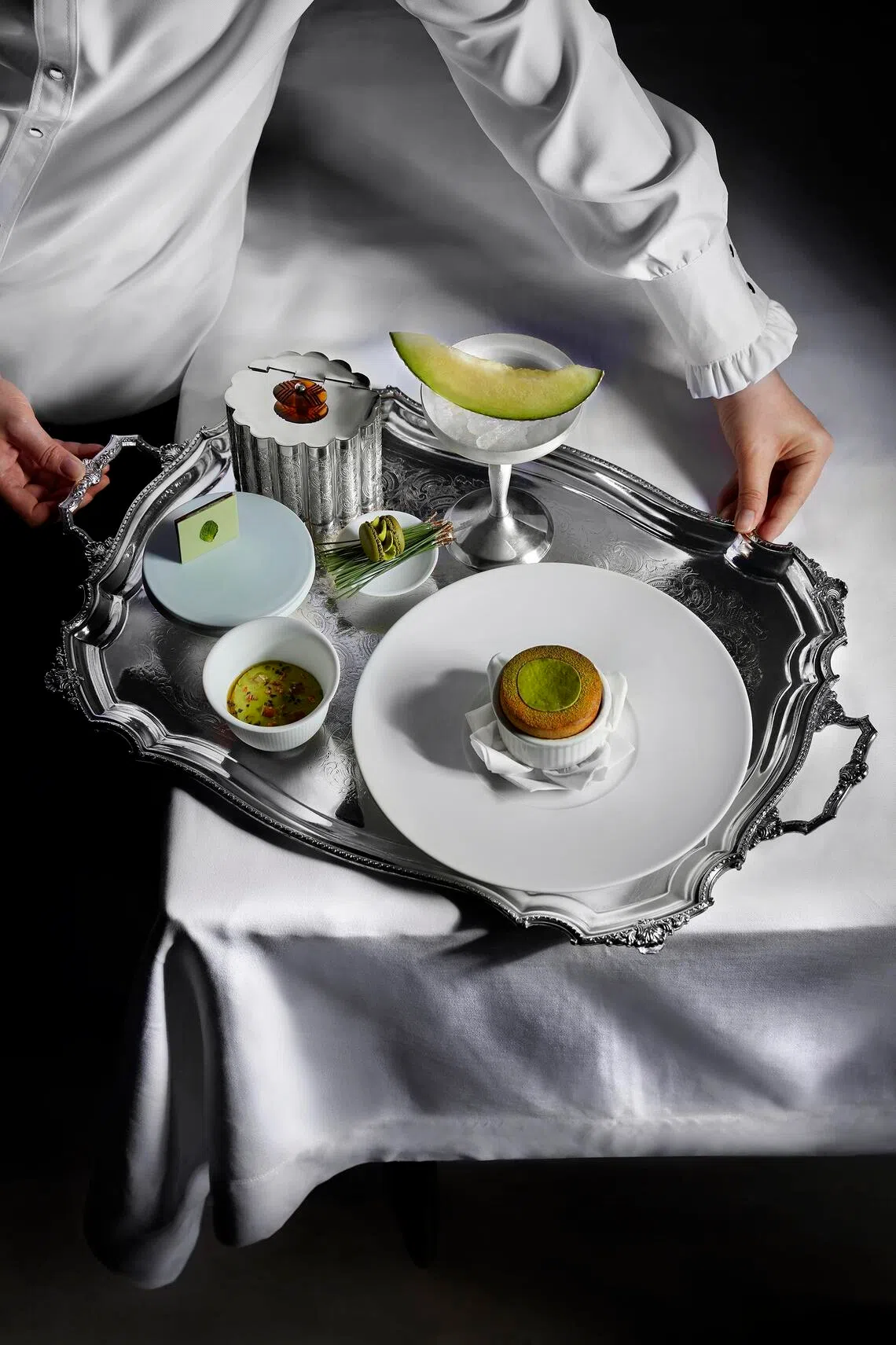 One of the desserts at 1887 by Andre is Verdant Forest ($32), comprising avocado souffle with pistachio kombu ice cream and matcha chocolate.