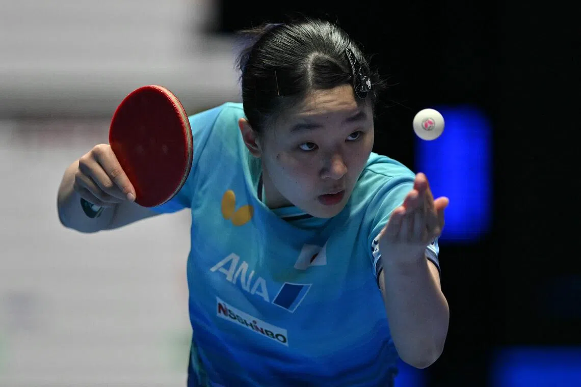 Japan’s Miwa Harimoto serves against China’s Wang Manyu during their Women’s Teams final match at the ITTF World Table Tennis Championships in Wembley Arena on May 10.