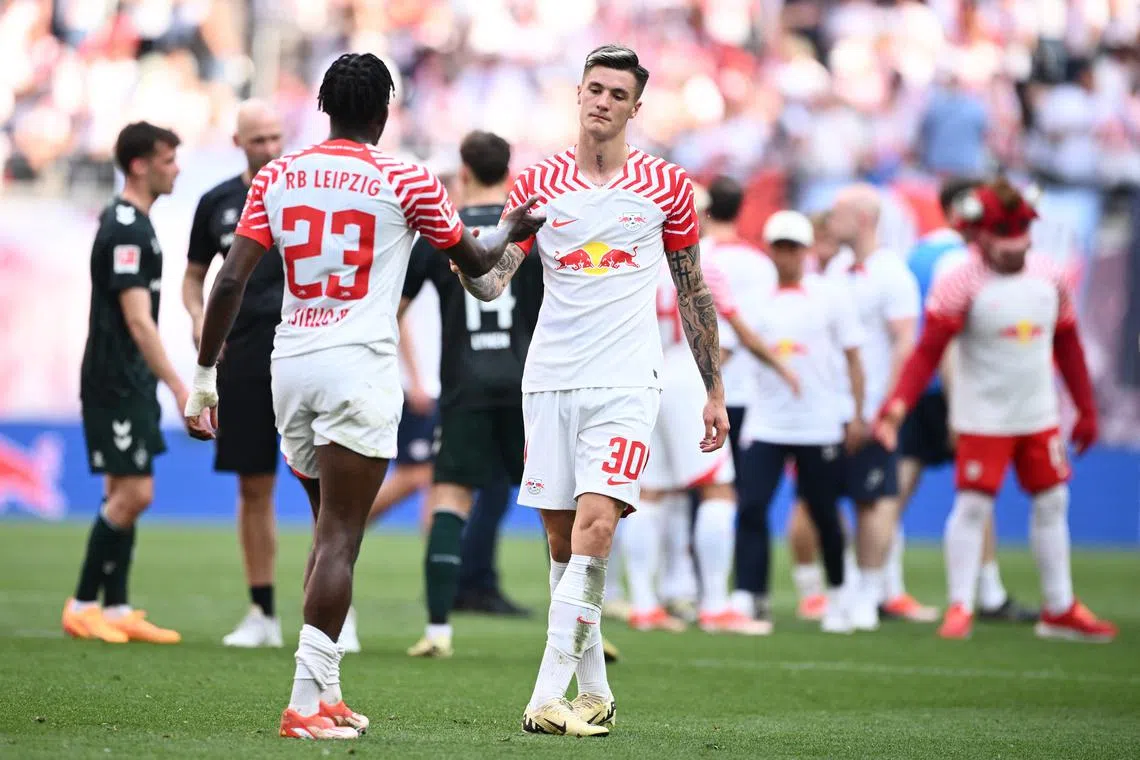 Soccer Football - Bundesliga - RB Leipzig v Werder Bremen - Red Bull Arena, Leipzig, Germany - May 11, 2024 RB Leipzig's Benjamin Sesko with Castello Lukeba after the match REUTERS/Annegret Hilse/ File Photo