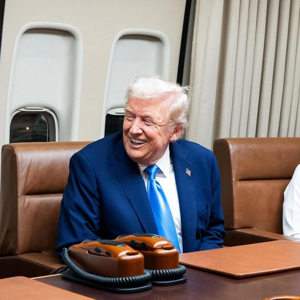 President Donald Trump (centre) meeting with Emir of Qatar Tamim bin Hamad Al Thani (left) and Qatari Prime Minister Mohammed bin Abdulrahman bin Jassim Al Thani aboard Air Force One on Oct 25, during a refuelling stop before continuing to Kuala Lumpur, Malaysia.