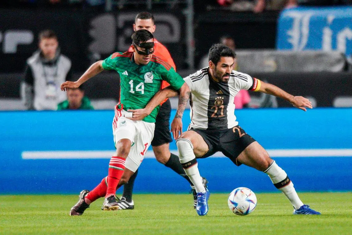 Germany's midfielder Ilkay Gundogan #21 and Mexico's forward Erick Sanchez #14 vie for the ball during the international friendly match between Germany and Mexico at Lincoln Financial Field stadium in Philadelphia on October 17, 2023. (Photo by EDUARDO MUNOZ / AFP)