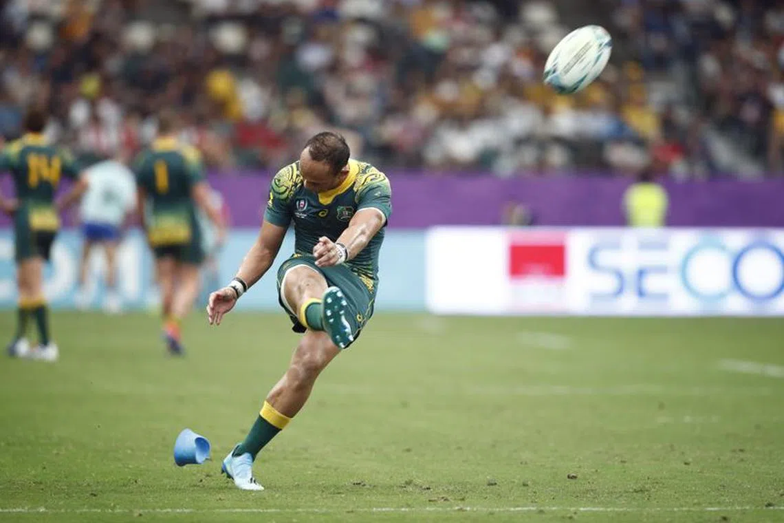FILE PHOTO-Rugby Union - Rugby World Cup 2019 - Pool D - Australia v Uruguay - Oita Stadium, Oita, Japan - October 5, 2019 Australia's Christian Leali'ifano converts a try REUTERS/Edgar Su/File Photo