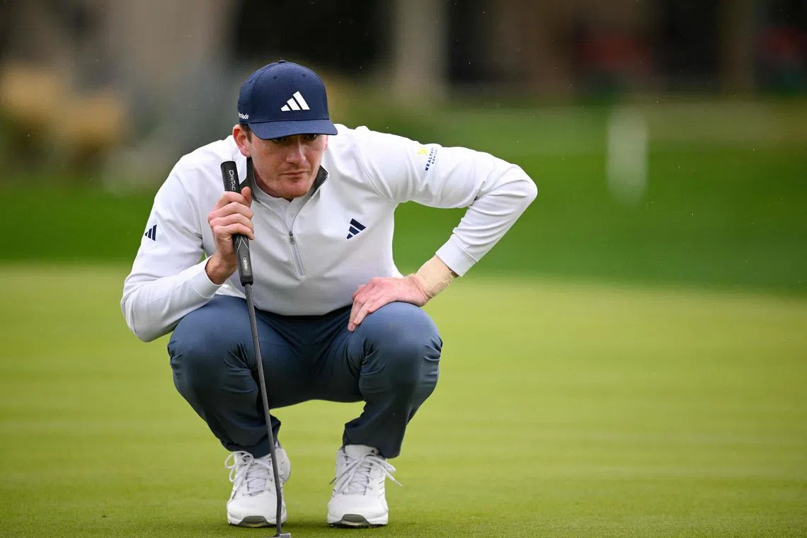 Nick Dunlap of the United States lining up a putt on the seventh green during the third round of The American Express at La Quinta Country Club on Jan 20 in La Quinta, California. He leads by three shots after shooting a 12-under 60 in the penultimate round.