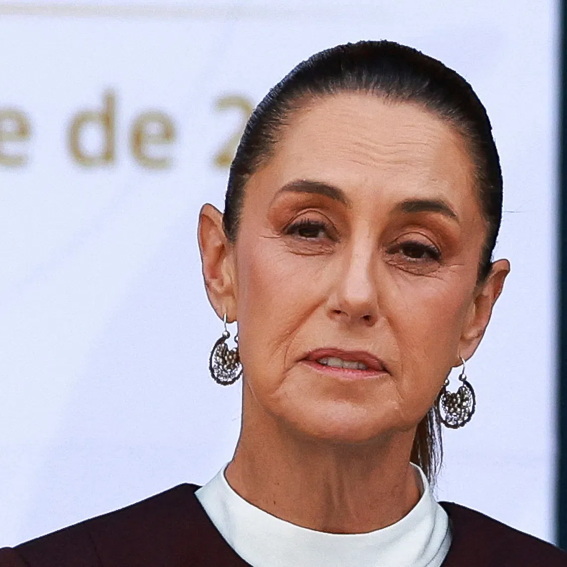 Mexico's President Claudia Sheinbaum speaks as she hosts a parade celebrating Independence Day, in Mexico City, Mexico September 16, 2025. REUTERS/Raquel Cunha