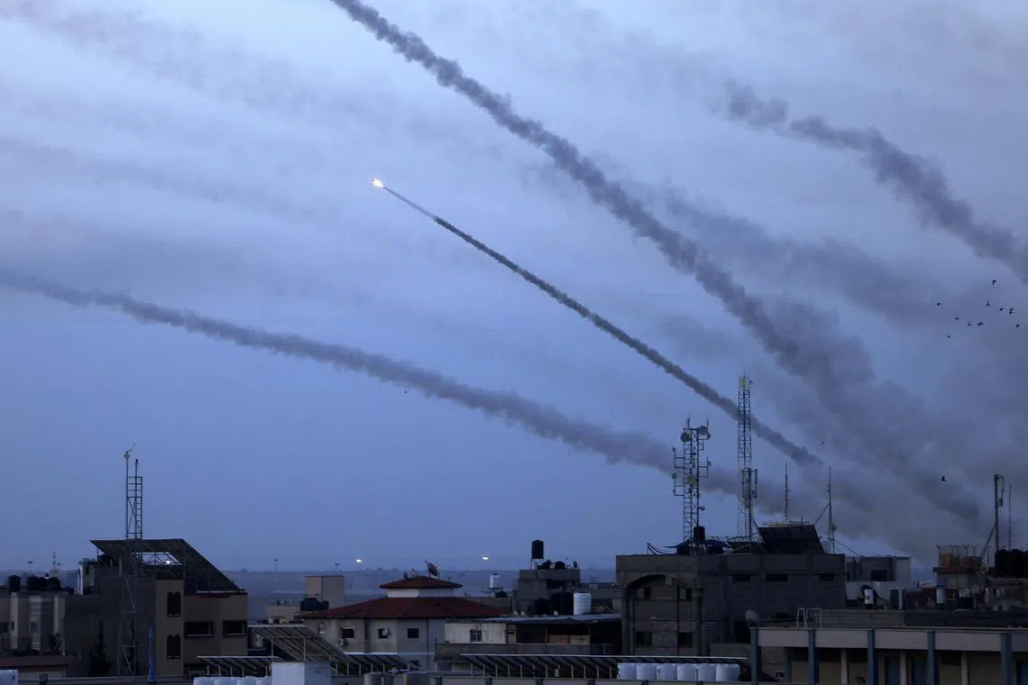 Rockets are fired from Gaza City towards Israel on October 7, 2023. Dozens of rockets were fired from the blockaded Gaza Strip towards Israel on October 7, 2023, an AFP journalist in the Palestinian territory said, as sirens warning of incoming fire blared in Israel. (Photo by SAID KHATIB / AFP)