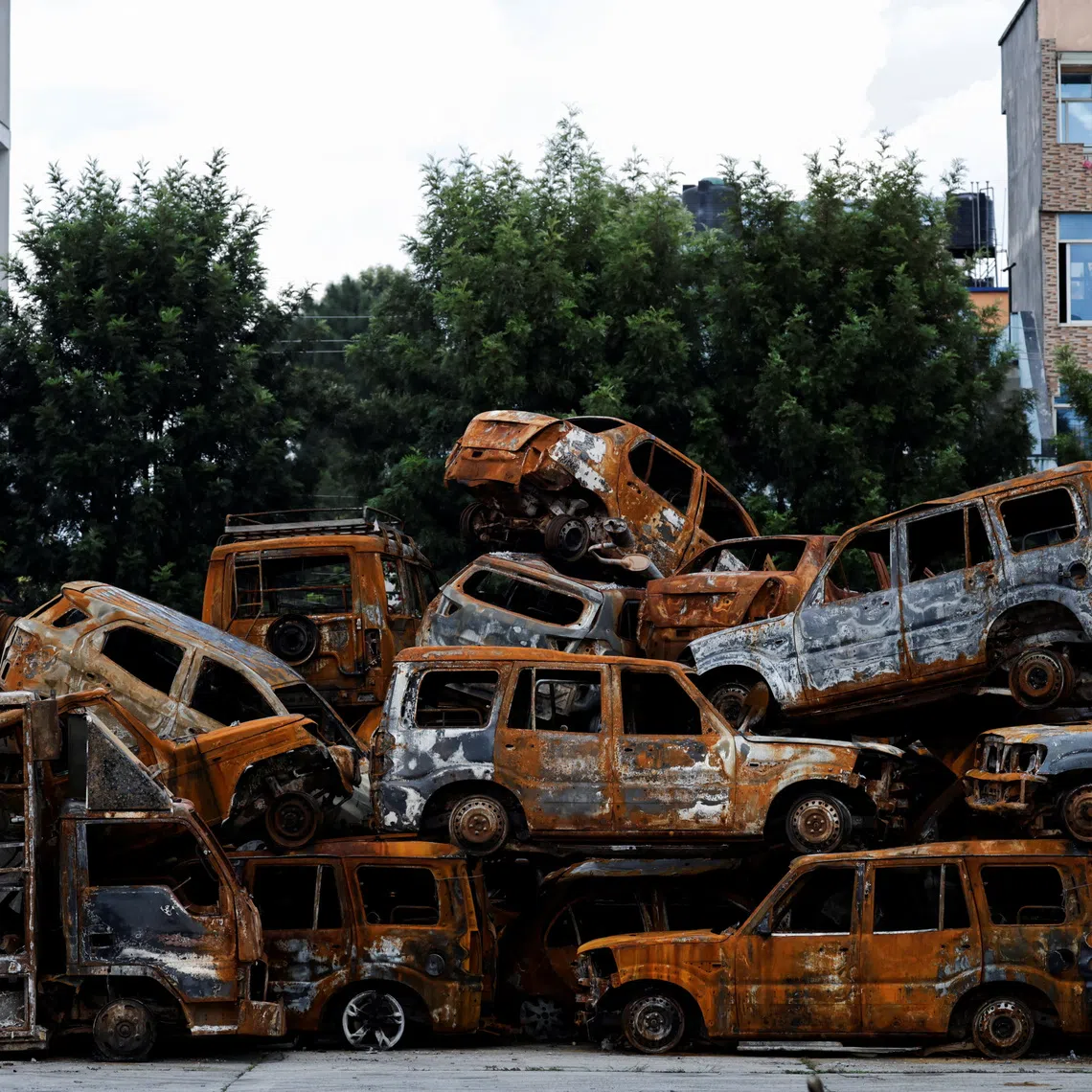 Remains of vehicles burned during the protest in September against corruption that toppled the government, are kept inside the premises of the parliament after being collected from various places in Kathmandu, Nepal October 7, 2025. REUTERS/Navesh Chitrakar