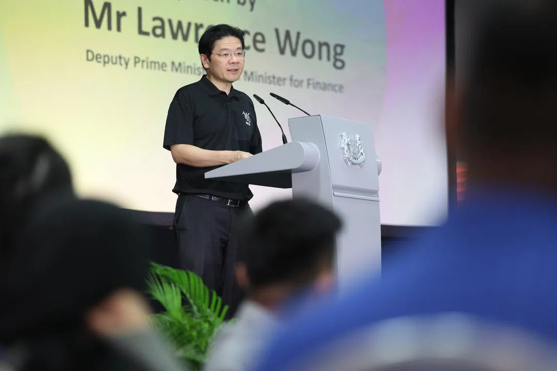 DPM Lawrence Wong speaking at the 10th anniversary celebration of the Social Service Office on Thursday.