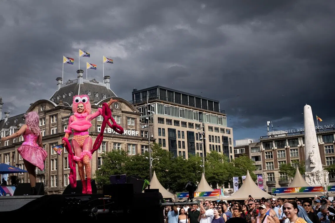 People taking part in a WorldPride street party at Dam Square in Amsterdam on July 31. This year marks the 30th anniversary of Pride Amsterdam and the 10th edition of WorldPride.
