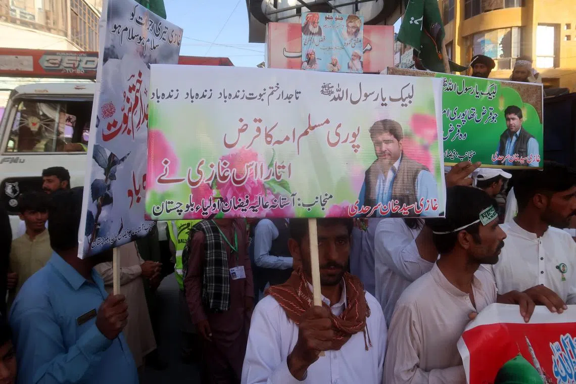 Supporters of the Tehreek-e-Labbaik Pakistan party attend a rally ahead of the celebration of the prophet Muhammad's birth anniversary and in support of Saad Khan Sarhadi, the police constable who killed a man accused of blasphemy in Quetta, Pakistan, on Sept 13, 2024.