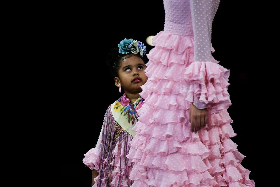 Models present creations by Maricruz Montecarlo during the Simof 2023 (International Flamenco Fashion Show) in Sevilla on Jan 29, 2023.