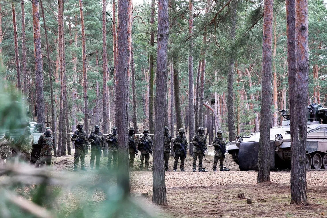 FILE PHOTO: Ukrainian soldiers stand in line at a training site as they undergo maintenance training on Leopard 1 A5 tanks, at the German army Bundeswehr base, part of the EU Military Assistance Mission in support of Ukraine (EUMAM UA) in Klietz, Germany, February 23, 2024. REUTERS/Liesa Johannssen/File Photo