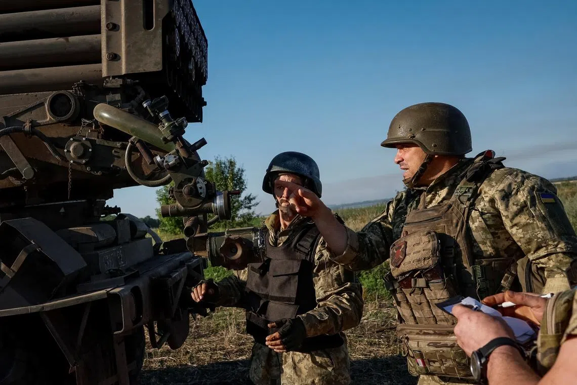 FILE PHOTO: Ukrainian service members of the 110th Colonel-General Marko Bezruchko Separate Mechanized Brigade prepare to fire an RM-70 Vampire multiple launch rocket system towards Russian troops, amid Russia's attack on Ukraine, at a position near a front line in Donetsk region, Ukraine June 30, 2024. REUTERS/Alina Smutko/File Photo