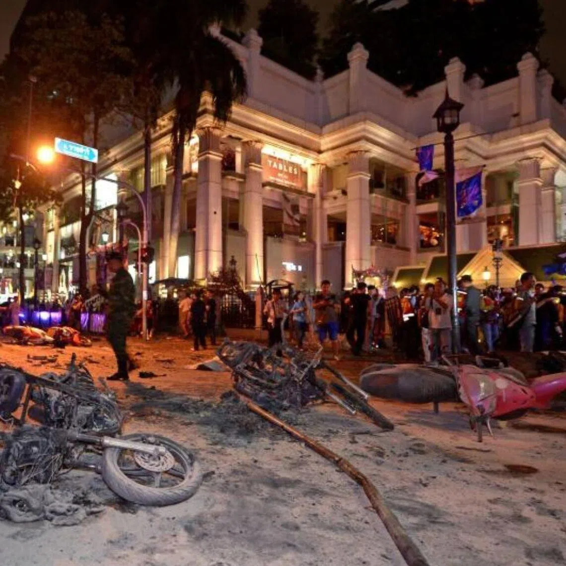 Thai soldiers inspect the scene after a bomb exploded at the Erawan Shrine in central Bangkok on Aug 17, 2015. 