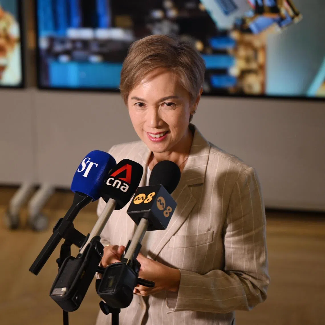 Minister for Digital Development and Information Josephine Teo speaking to the media after a tour of the UBS AI and Transformation Factory, its largest and first, on Oct 6, 2025.

ST PHOTO: AZMI ATHNI