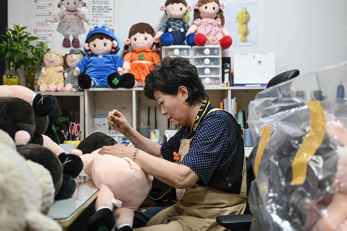 This photo taken on May 6, shows an employee working on a Hyodol at the company’s headquarters in Anyang.