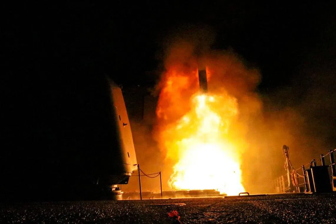 FILE PHOTO: The U.S. Navy guided-missile cruiser USS Monterey fires a Tomahawk land attack missile April 14, 2018. U.S. Navy/Lt. j.g Matthew Daniels/Handout via REUTERS/File Photo