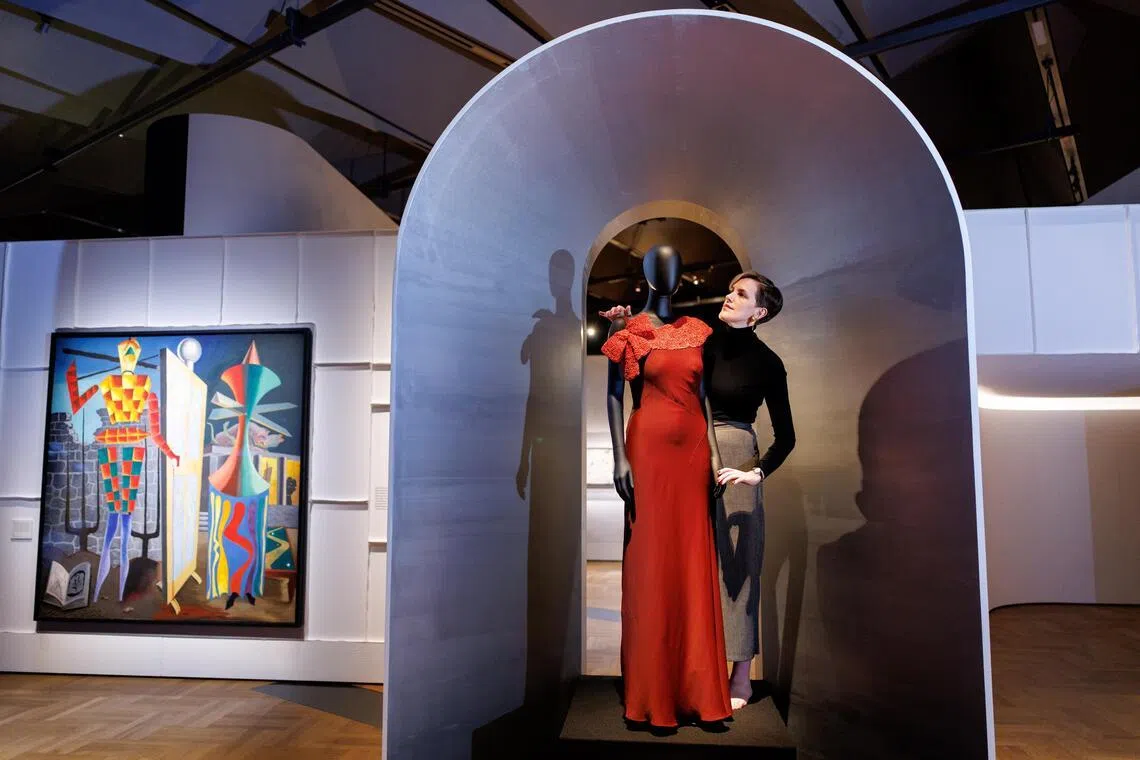 The 1932 Red Evening Dress by Schiaparelli. The exhibition on the Italy-born designer and her namesake fashion house features more than 200 items, including photographs and artworks. 