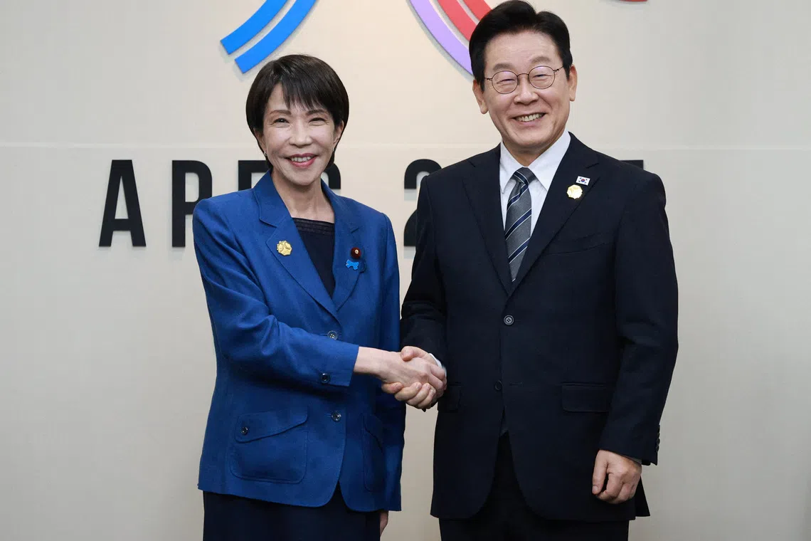 Japanese Prime Minister Sanae Takaichi shakes hands with South Korea's President Lee Jae Myung during the sideline meeting of the Asia-Pacific Economic Cooperation (APEC) summit in Gyeongju, South Korea, October 30, 2025.   Yonhap via REUTERS   THIS IMAGE HAS BEEN SUPPLIED BY A THIRD PARTY. NO RESALES. NO ARCHIVES. SOUTH KOREA OUT. NO COMMERCIAL OR EDITORIAL SALES IN SOUTH KOREA.