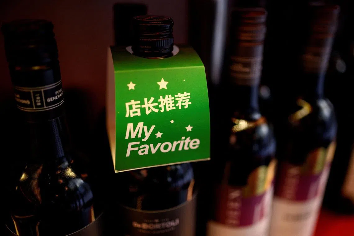 Australian wines displayed at a wine shop in Beijing. China said on March 28, 2024 it would lift punitive tariffs on Australian wine, as trade ties improve between the two countries after years of tension.