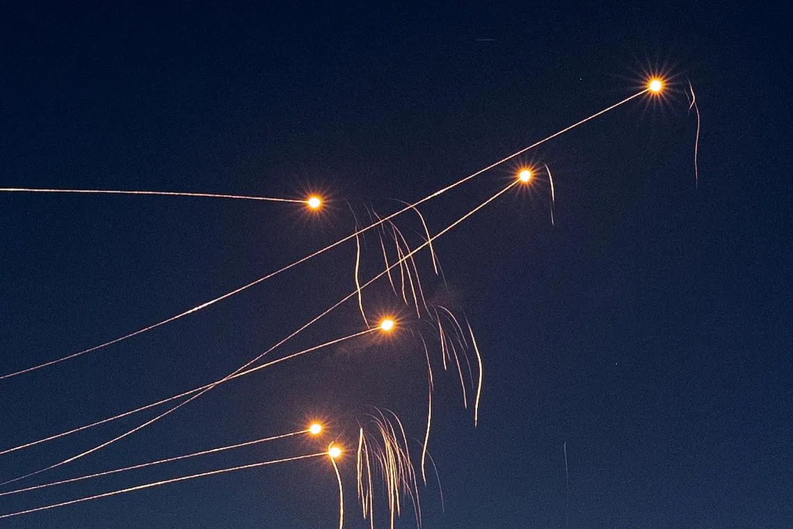 FILE PHOTO: Israel's Iron Dome anti-missile system intercepts rockets launched from the Gaza Strip, after a temporary truce between Israel and the Palestinian Islamist group Hamas expired, as seen from Ashkelon, Israel, December 1, 2023. REUTERS/Amir Cohen