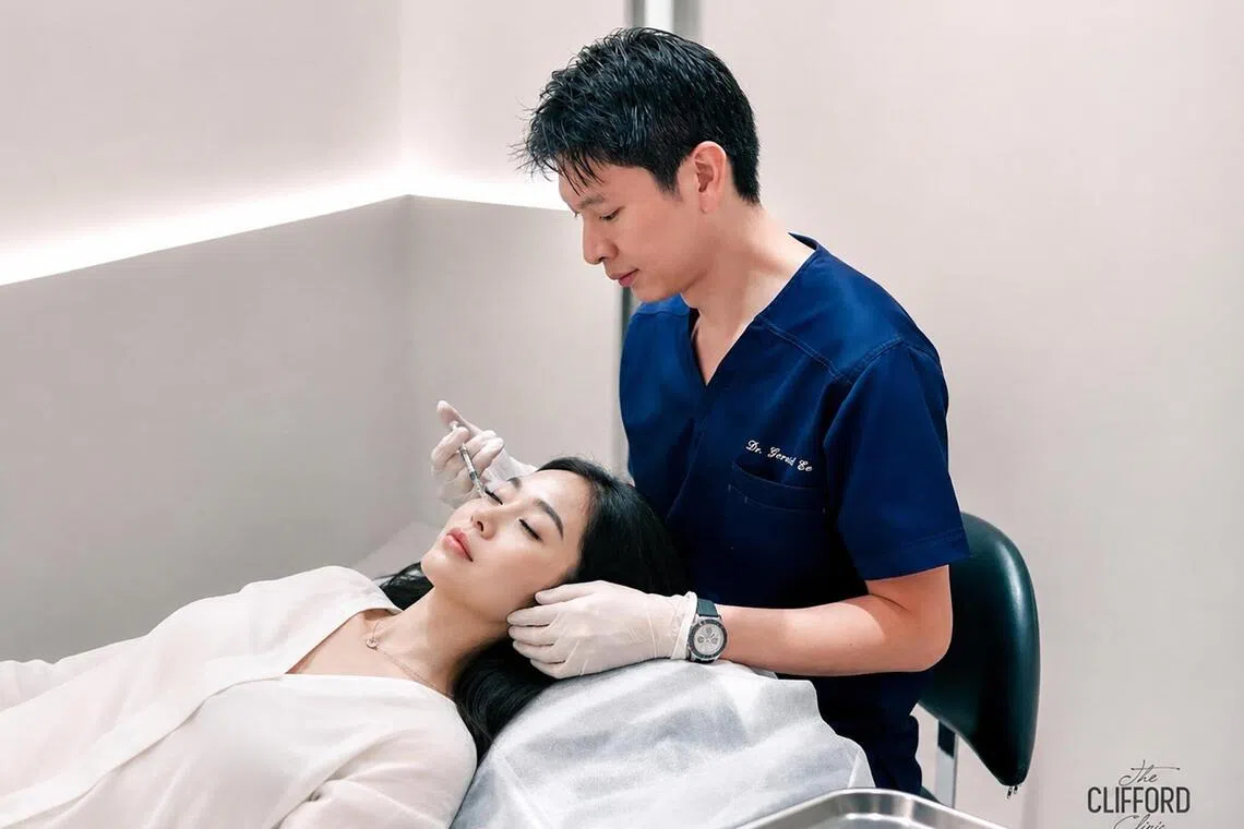 Gerard Ee administering a PN shot to a patient.