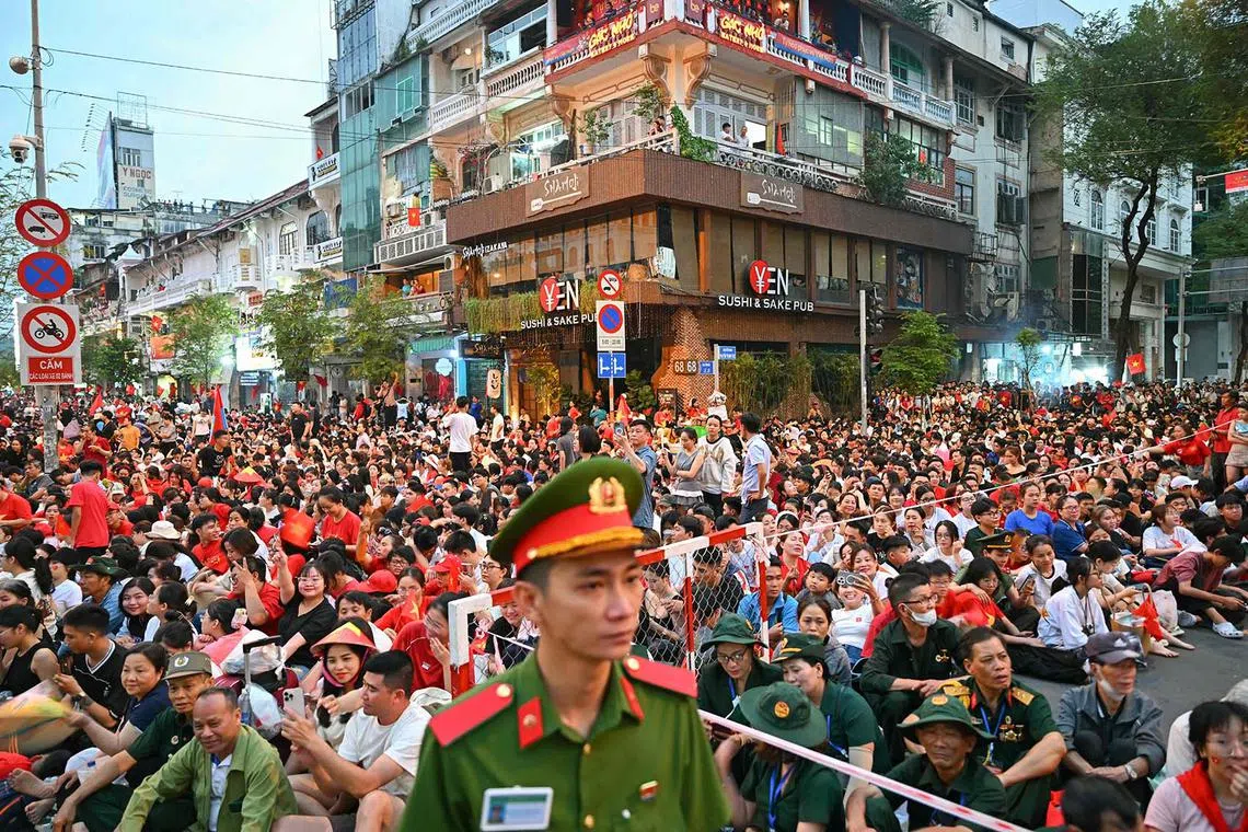 People awaiting the parade marking the 50th anniversary of the fall of Saigon and the end of the Vietnam War in Ho Chi Minh City on April 30, 2025.