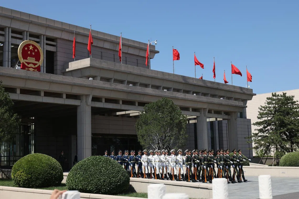 FILE PHOTO: Members of the honor guard march to the tarmac as they prepare to welcome the arrival of Zimbabwe President Emmerson Mnangagwa at the Beijing Capital International Airport on September 01, 2025 in Beijing, China.  Lintao Zhang/Pool via REUTERS/File photo
