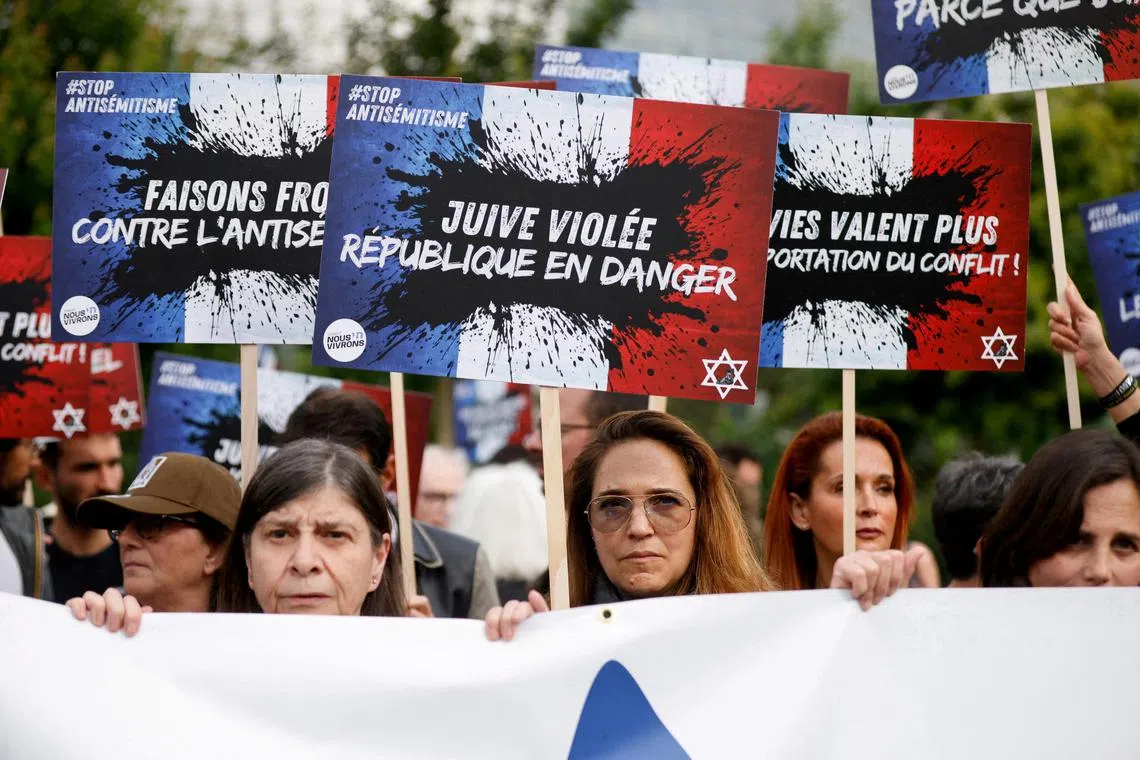 FILE PHOTO: People attend a demonstration against antisemitism at the Place de la Bastille after three teenagers aged 12 to 13 were indicted in Courbevoie, accused of rape and antisemitic violence against a 12-year-old girl, in Paris, France, June 20, 2024. REUTERS/Johanna Geron/File Photo