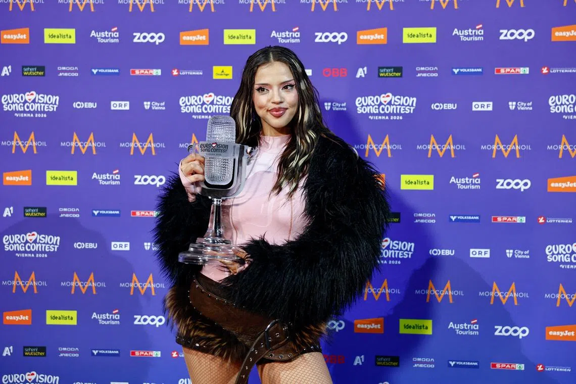 The winner of the 2026 Eurovision Song Contest, DARA, representing Bulgaria, holds the trophy at a press conference after the Grand Final, in Vienna, Austria, May 17, 2026. REUTERS/Lisa Leutner