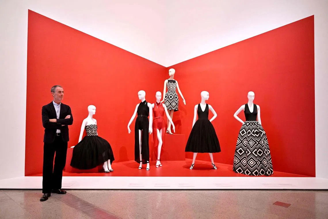 Fashion designer Martin Grant posing with some of the garments at an exhibition held at the National Gallery of Victoria (NGV) in Melbourne, on March 27, 2025. 