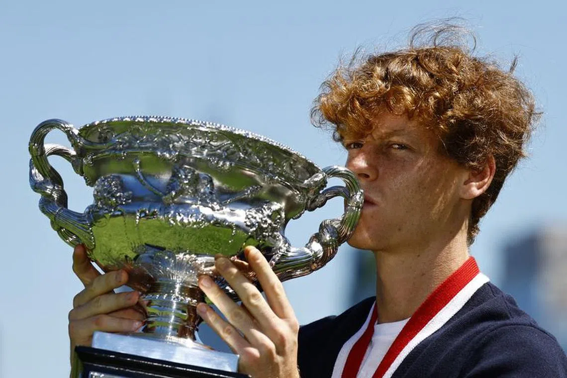 Tennis - Australian Open - Men's Singles Winner Photo Shoot - Royal Botanic Gardens Victoria, Melbourne, Australia - January 29, 2024 Italy's Jannik Sinner poses with the Australian Open trophy REUTERS/Issei Kato