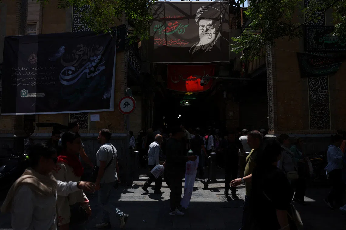 A banner depicting Iran’s late supreme leader Ayatollah Ali Khamenei in the Grand Bazaar in Tehran.