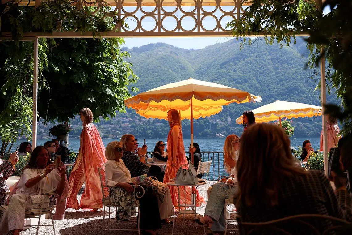 Models presenting creations by French fashion house Chanel as part of their Cruise 2025/26 collection show at Lake Como, Italy, April 29, 2025. 