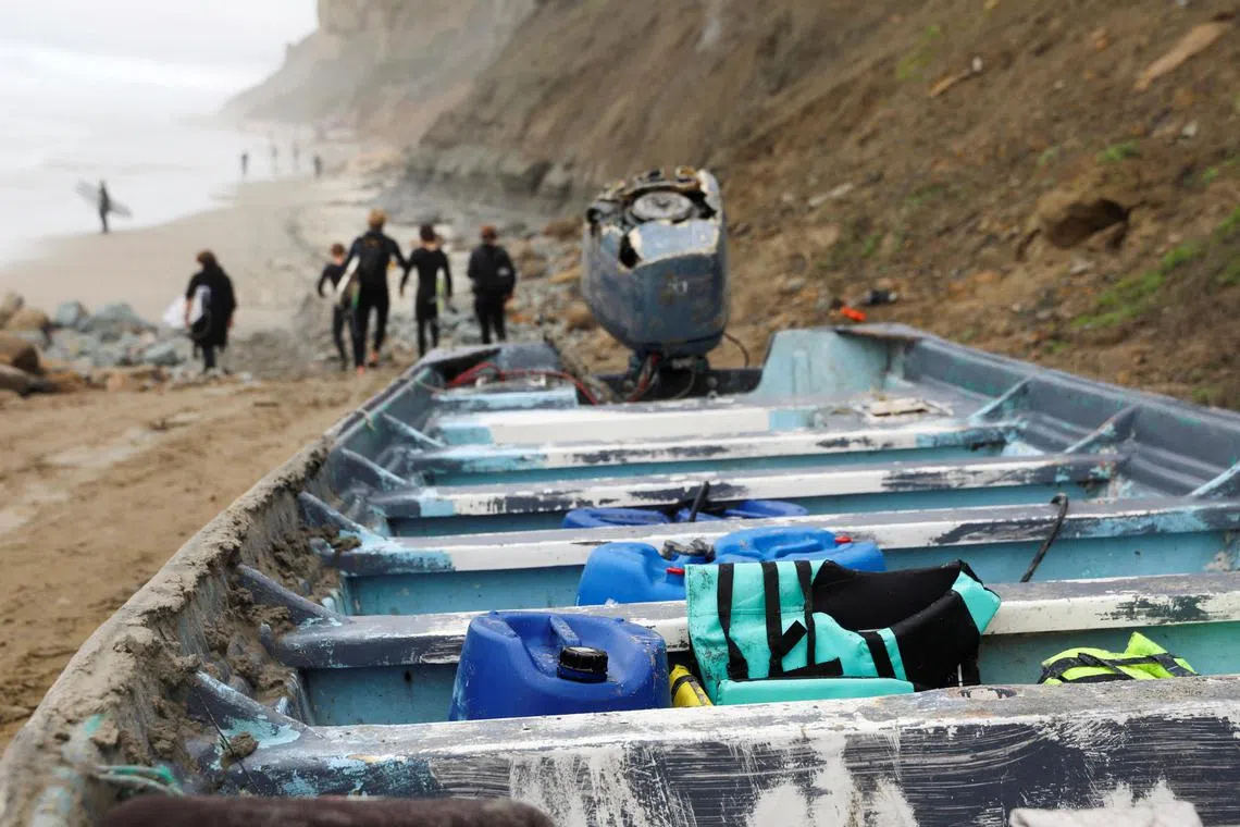 Life jackets lay in a panga boat, which sits at the Black's Beach, after two panga fishing boats capsized off the coast of San Diego, following an apparent migrant smuggling operation according to emergency officials, in San Diego, California, U.S., March 12, 2023. REUTERS/Sandy Huffaker