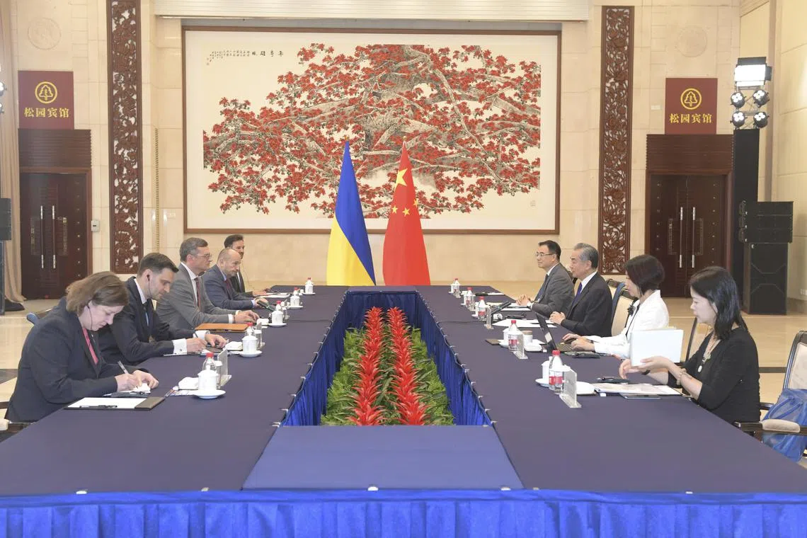 Chinese Foreign Minister Wang Yi (second from right) holding talks with Ukrainian Foreign Minister Dmytro Kuleba (third from left) in Guangzhou, on July 24.