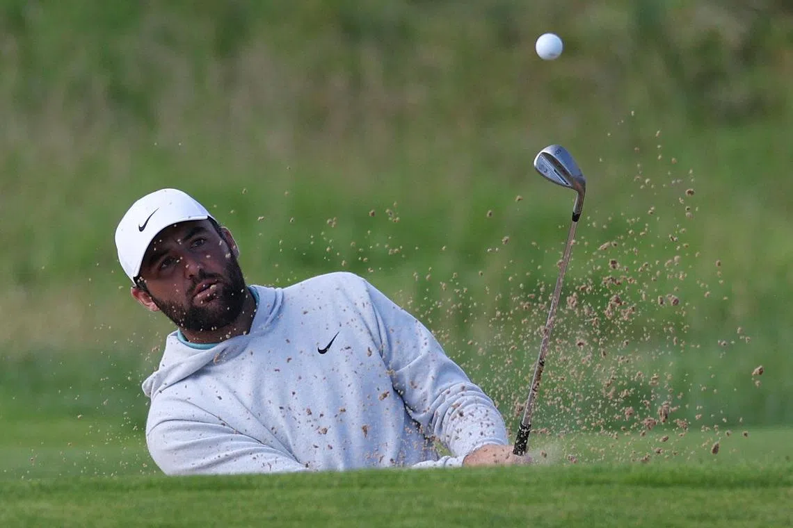 Scottie Scheffler of the US playing out from a bunker during a practice round at Royal Portrush Golf Club in Northern Ireland on July 16, ahead of the Open Championship, which tees off on July 17.