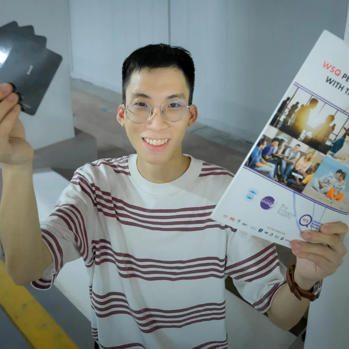 John Ng with his Enneagram textbook and cards, Aug 2, 2023.