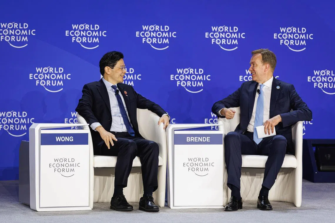 Prime Minister Lawrence Wong (left) and World Economic Forum (WEF) president Borge Brende at a WEF event in Tianjin, on June 25.