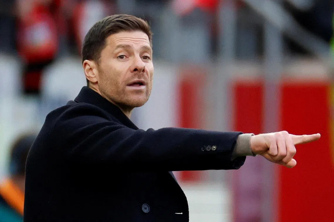 FILE PHOTO: Soccer Football - Bundesliga - 1. FC Heidenheim v Bayer Leverkusen - Voith-Arena, Heidenheim, Germany - February 17, 2024 Bayer Leverkusen coach Xabi Alonso reacts REUTERS/Heiko Becker