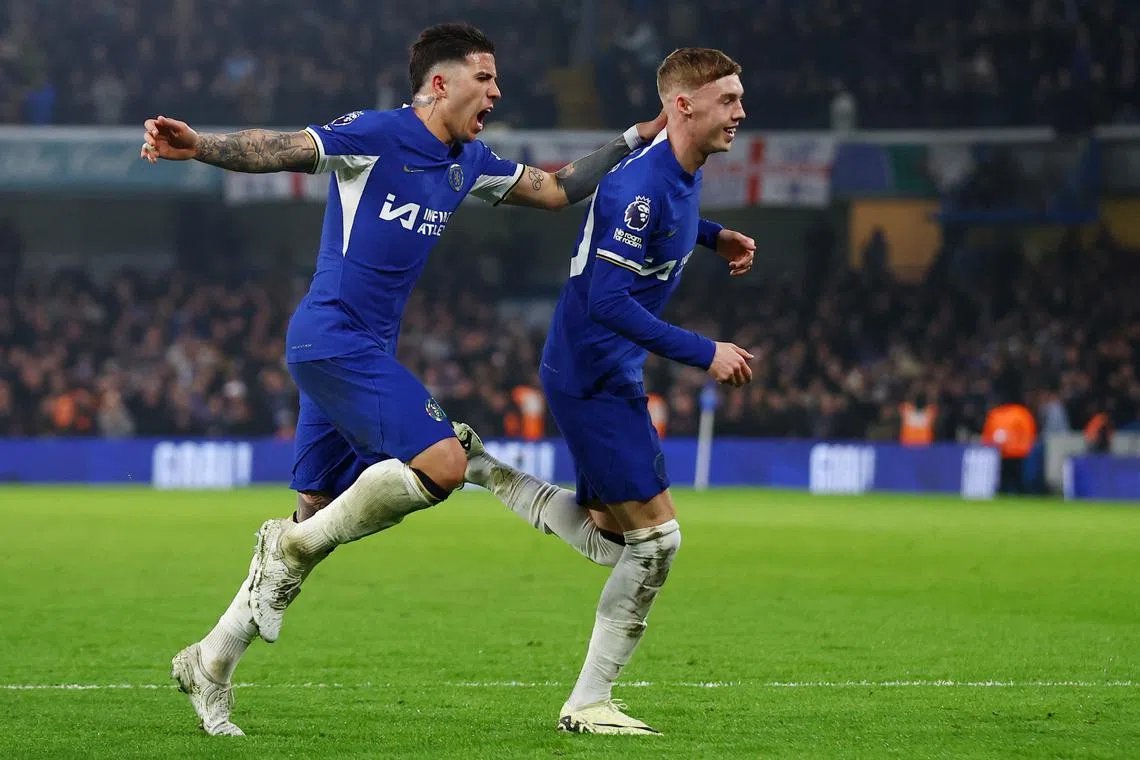 Soccer Football - Premier League - Chelsea v Newcastle United - Stamford Bridge, London, Britain - March 11, 2024 Chelsea's Cole Palmer celebrates scoring their second goal with Enzo Fernandez Action Images via Reuters/Matthew Childs/File Photo