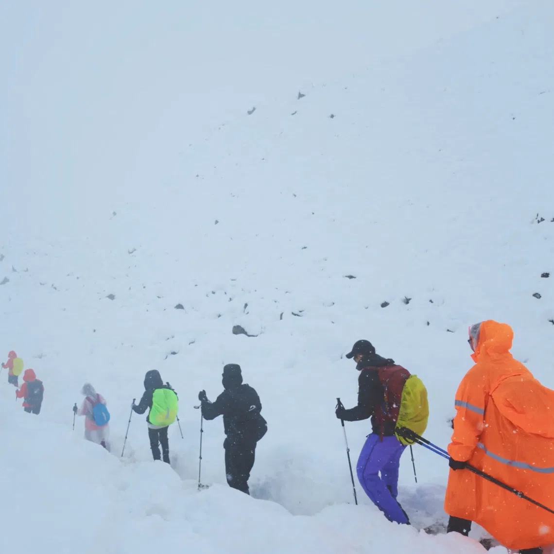 A screen capture from video shows trekkers leaving their campsite, as unusually heavy snow and rainfall pummeled the Himalayas, in the Tibet Region, China, October 5, 2025. Geshuang Chen/Handout via REUTERS